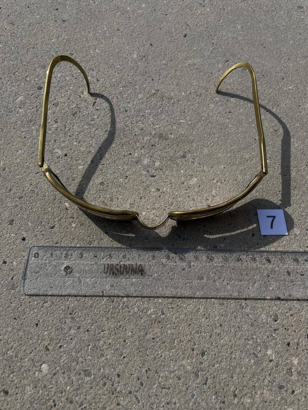 Brass frame of the mammoth ivory goggles seen from behind