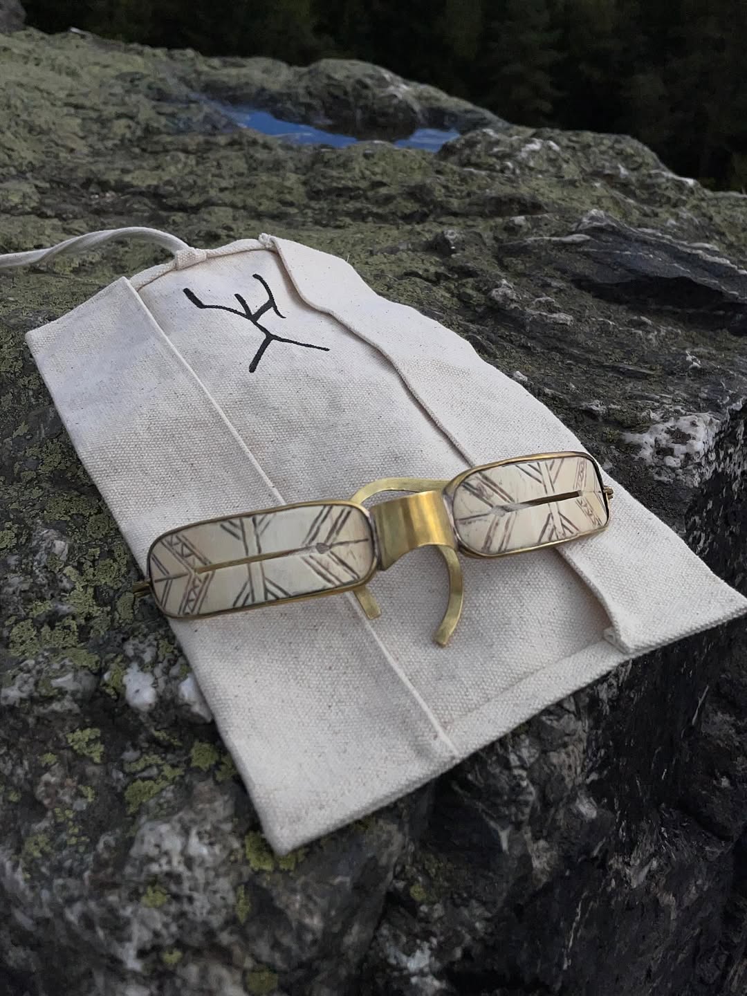 URSUUNA cotton wrap case with mammoth ivory goggles on stone